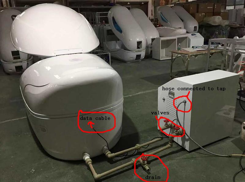 Manufacturer's new-pod connection photograph showing hoses between the pod and the open control cabinet